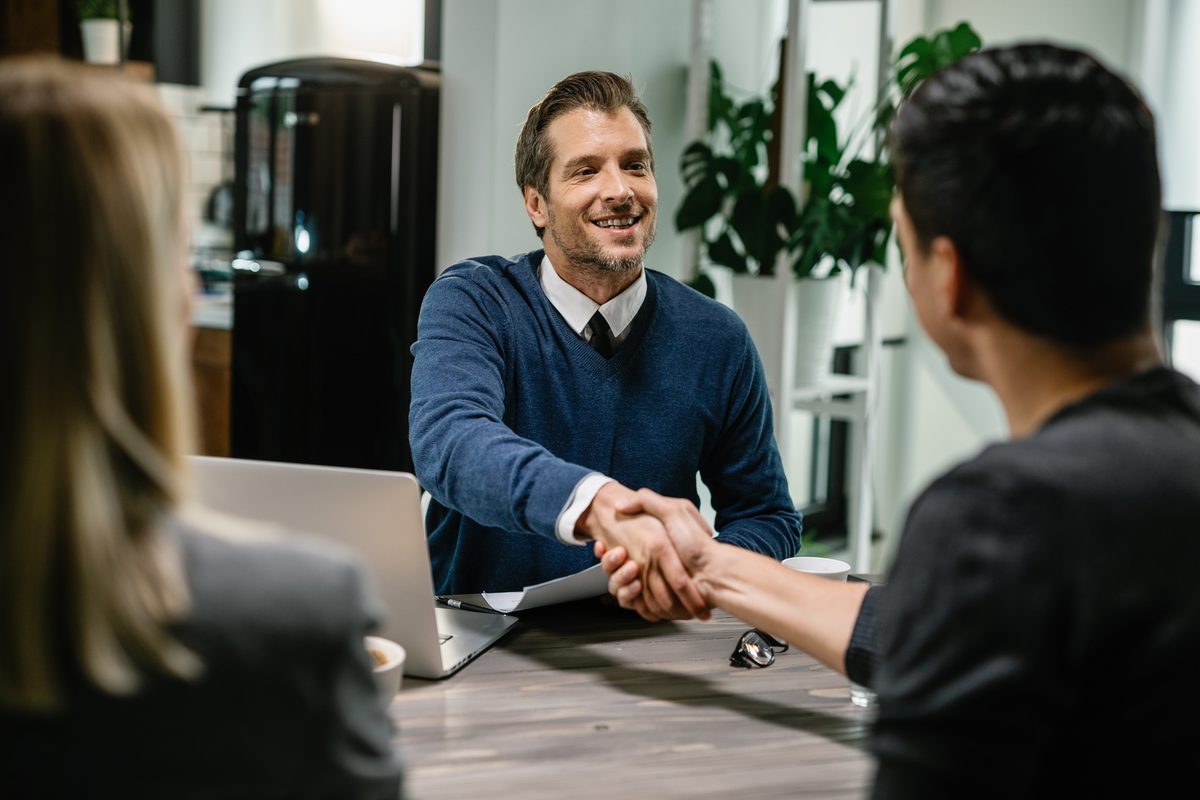 Financial consultant greeting clients - building trusted partnerships