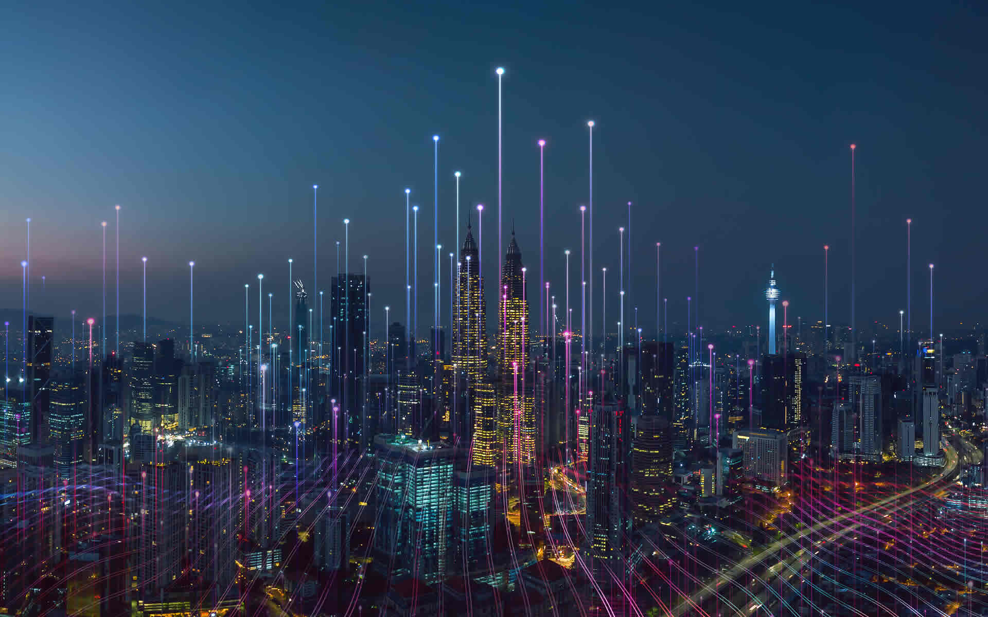 Smart city skyline at night - digital connectivity, data flows, and urban infrastructure